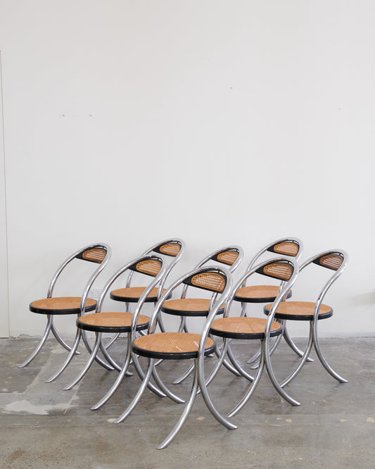 SET OF EIGHT CURVED CHROME & RATTAN CHAIRS