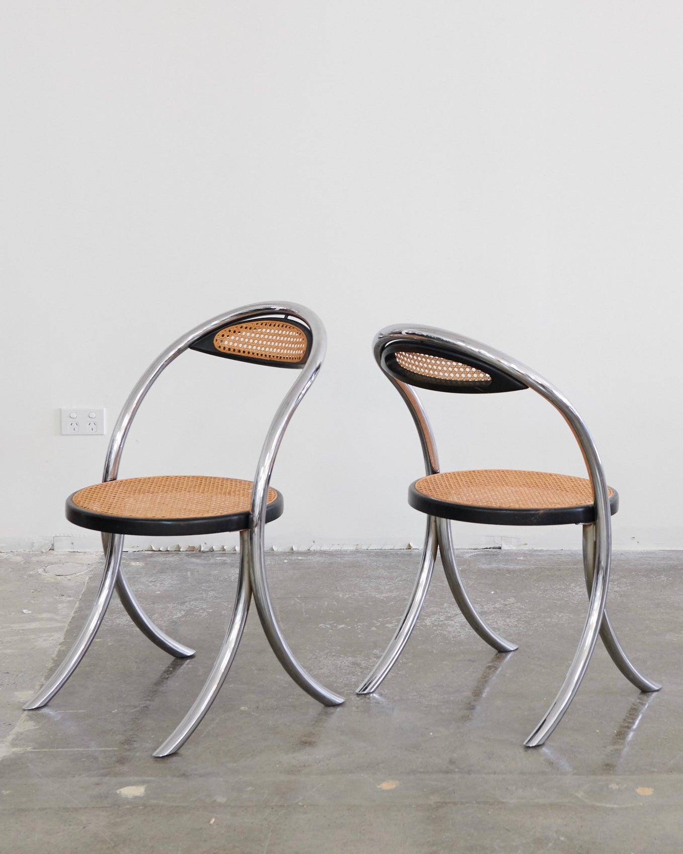 SET OF EIGHT CURVED CHROME & RATTAN CHAIRS