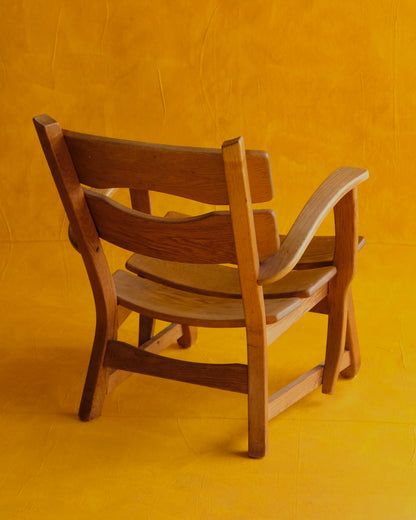 PAIR OF SCULPTURAL FRENCH OAK ARMCHAIRS