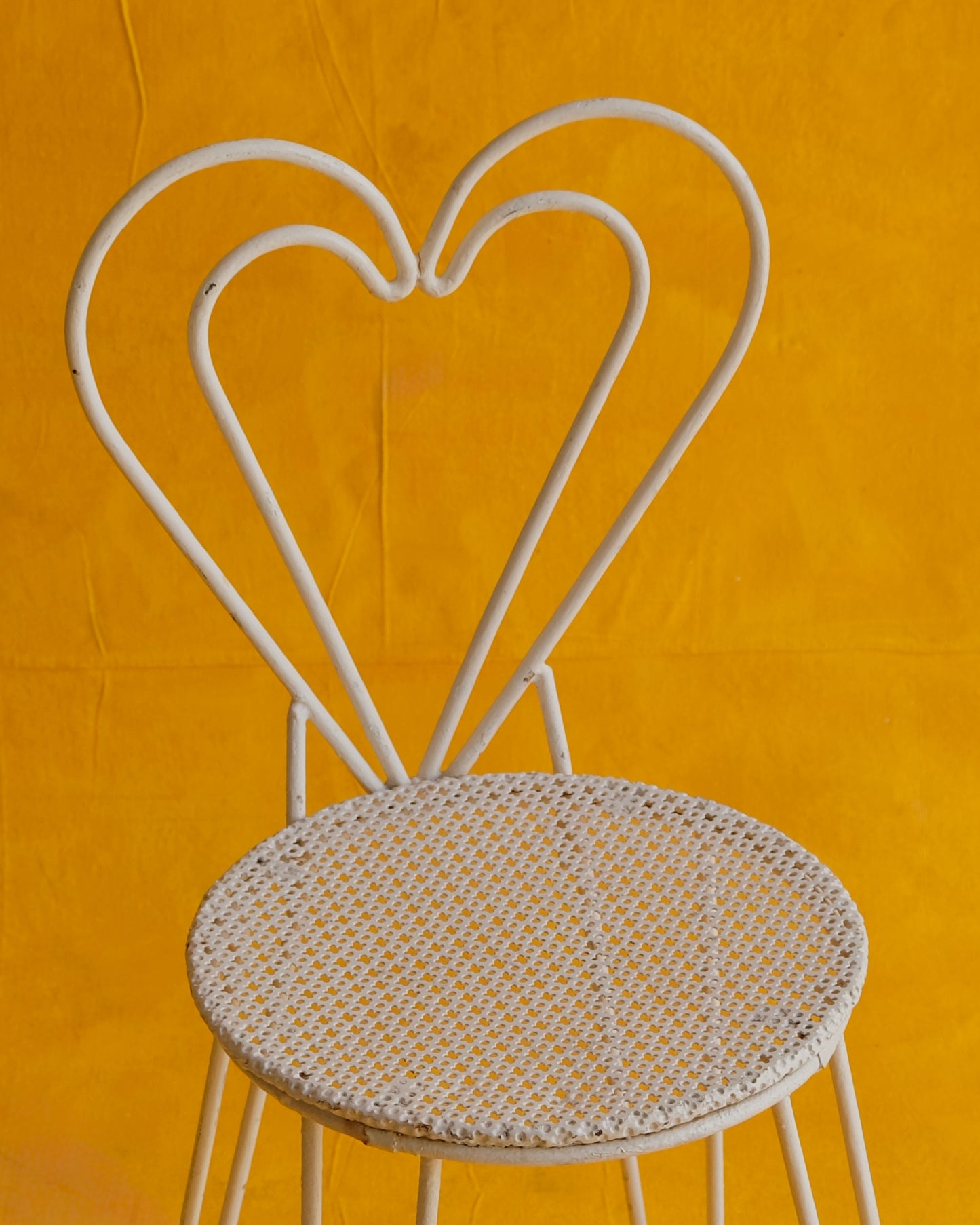 PAIR OF WHITE METAL HEART CHAIRS