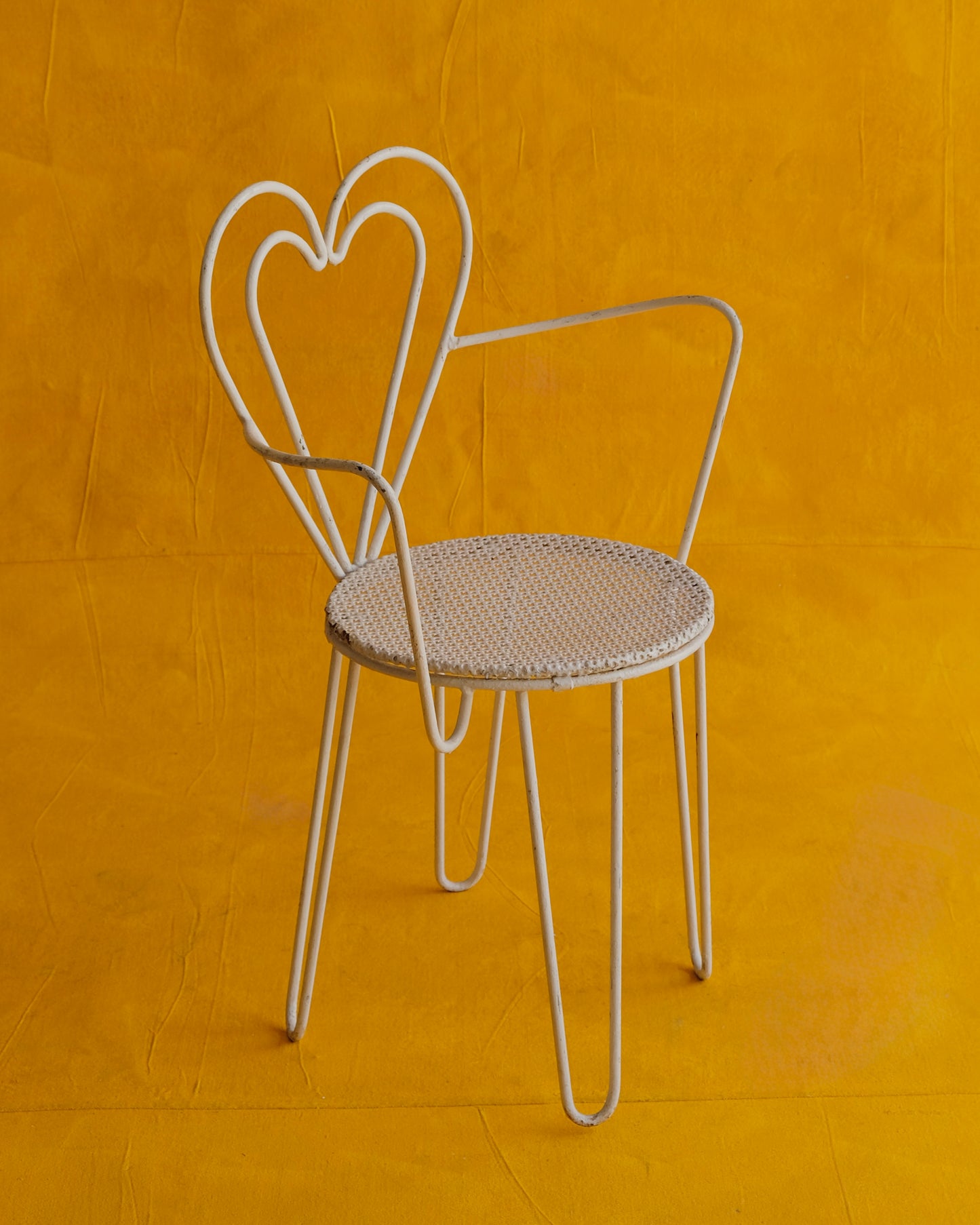 PAIR OF WHITE METAL HEART ARMCHAIRS