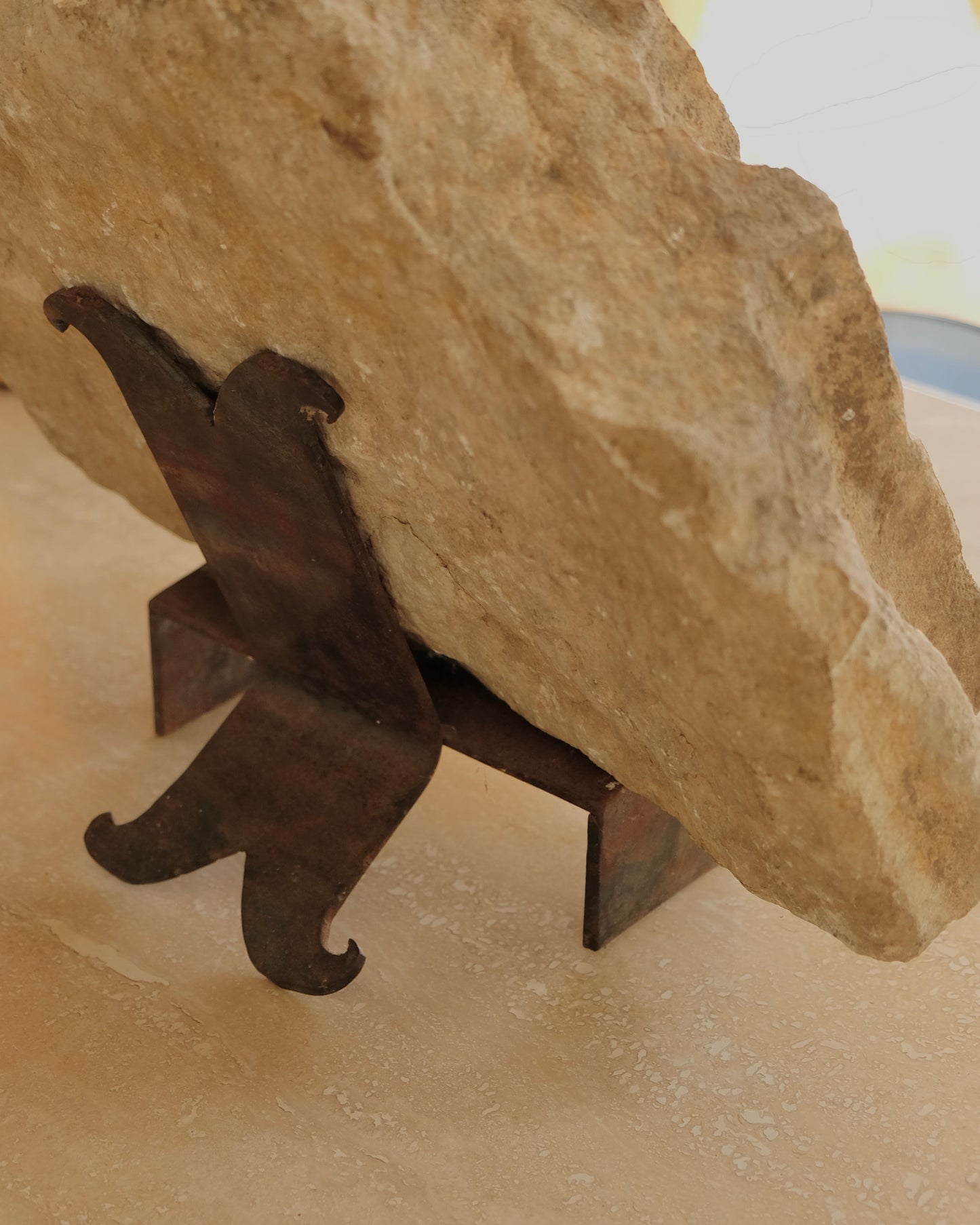 CARVED STONE FRAGMENT w. CURLED WROUGHT IRON STAND