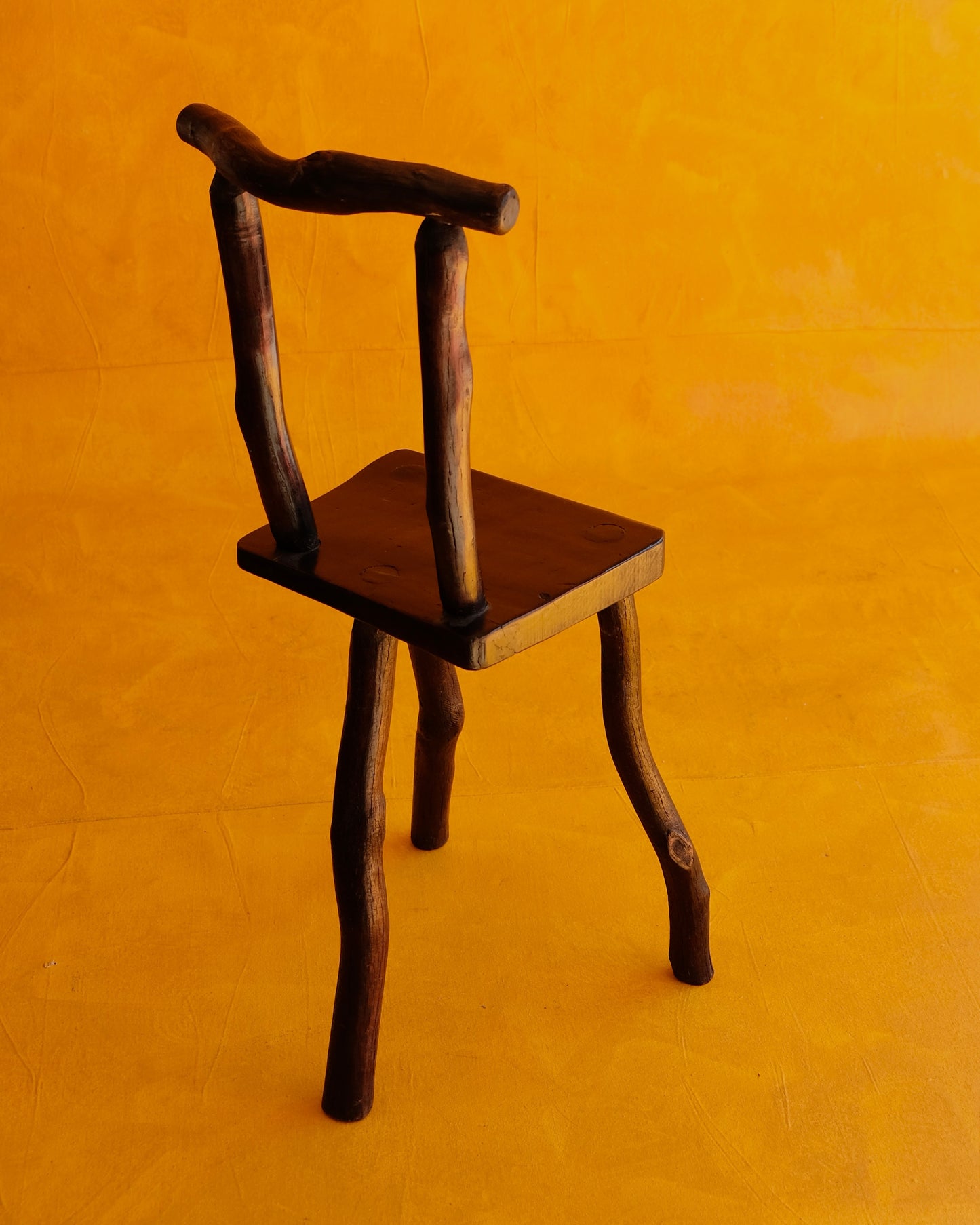 HAND CARVED EBONIZED PRIMITIVE TALL CHAIR