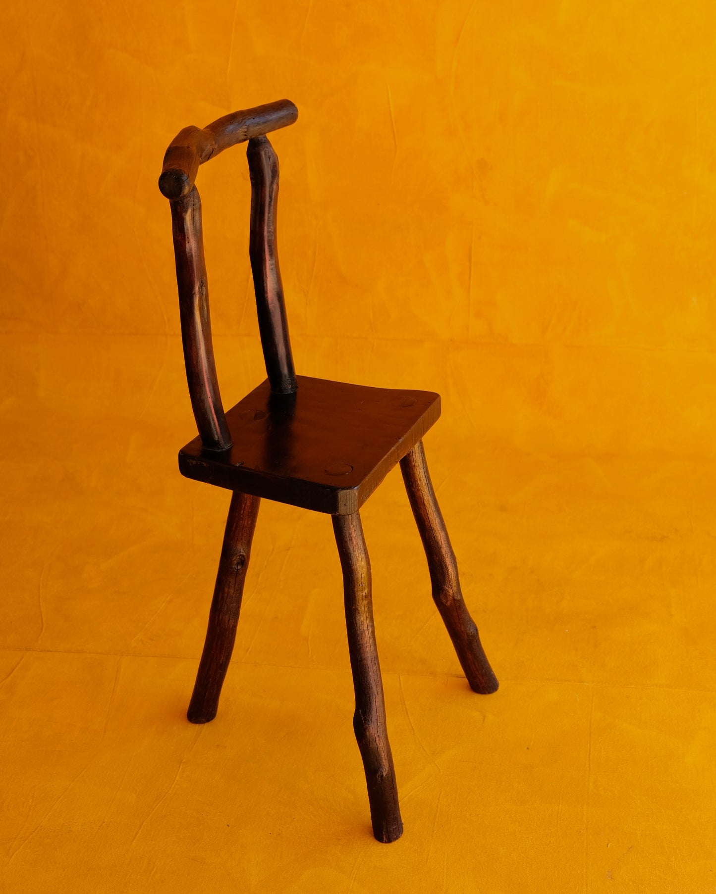 HAND CARVED EBONIZED PRIMITIVE TALL CHAIR