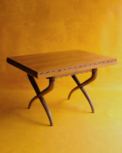 HAND CARVED CROSS LEG TABLE w. WAVE EDGE DETAIL