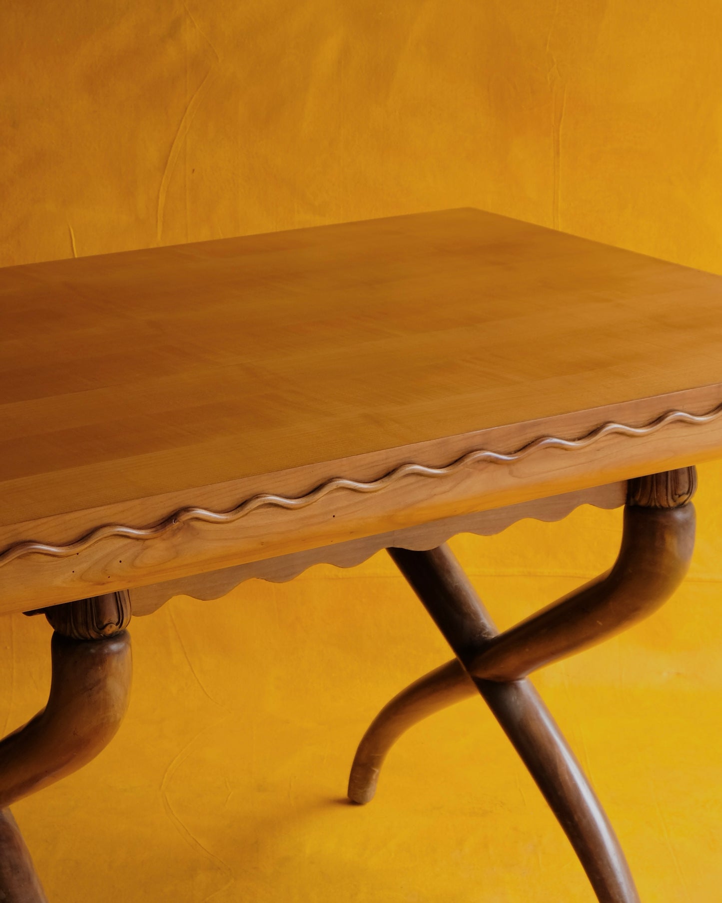 HAND CARVED CROSS LEG TABLE w. WAVE EDGE DETAIL