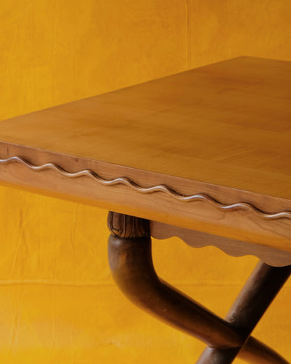 HAND CARVED CROSS LEG TABLE w. WAVE EDGE DETAIL