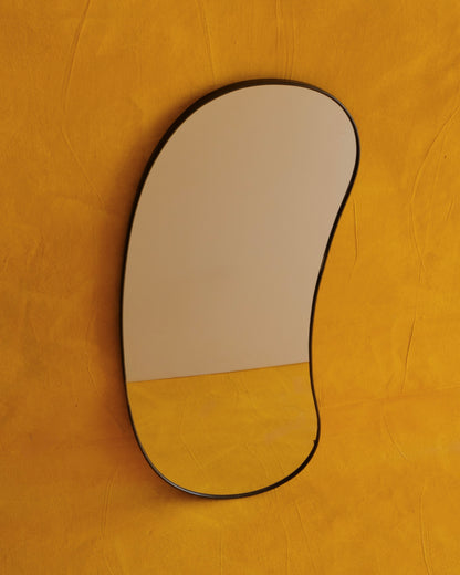 MODERNIST CURVED BRASS MIRROR