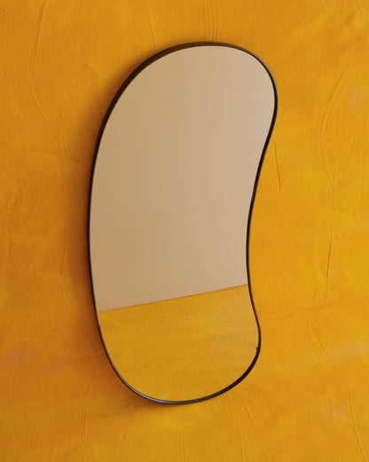 MODERNIST CURVED BRASS MIRROR