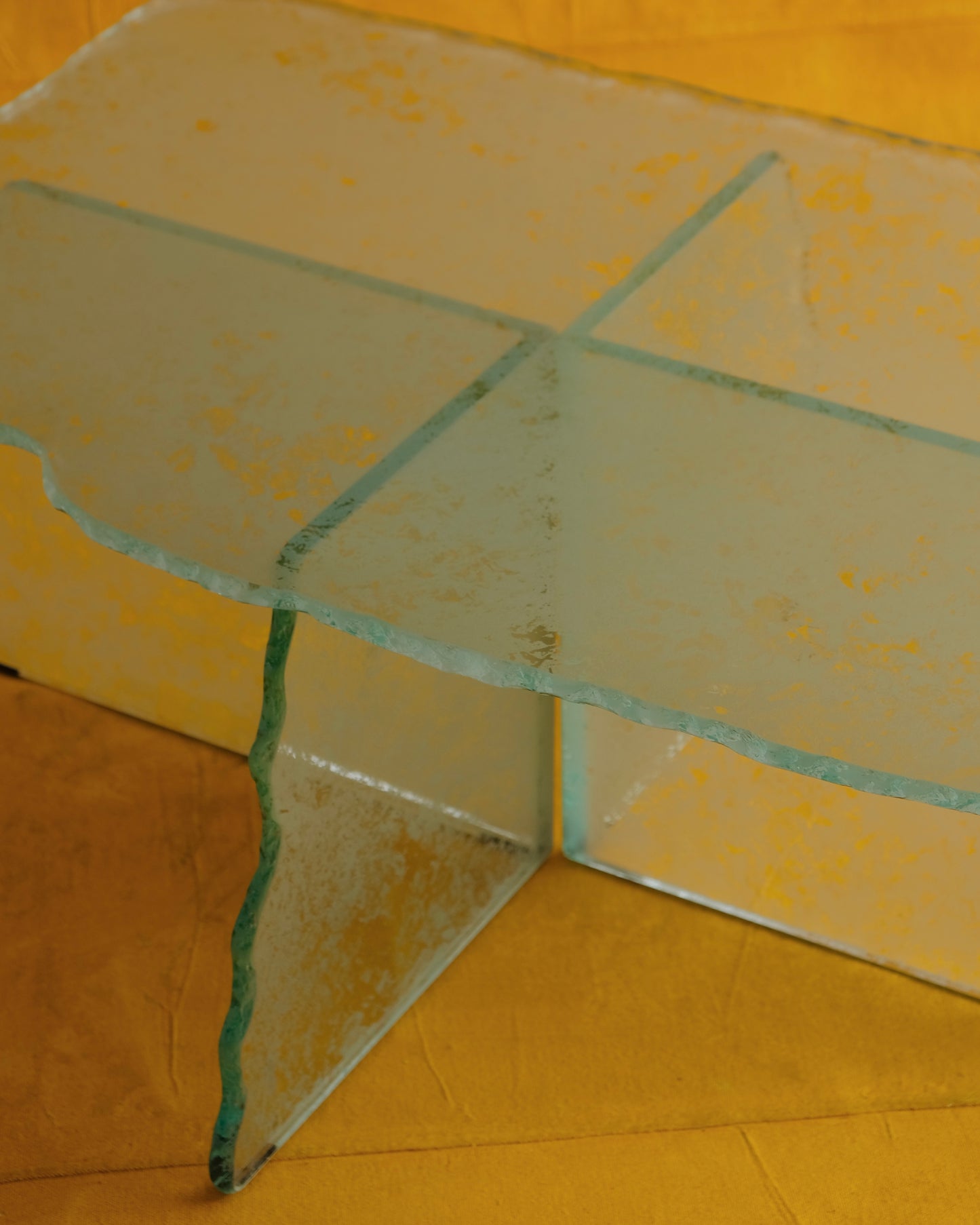HAND CARVED GLASS CROSS BASED COFFEE TABLE
