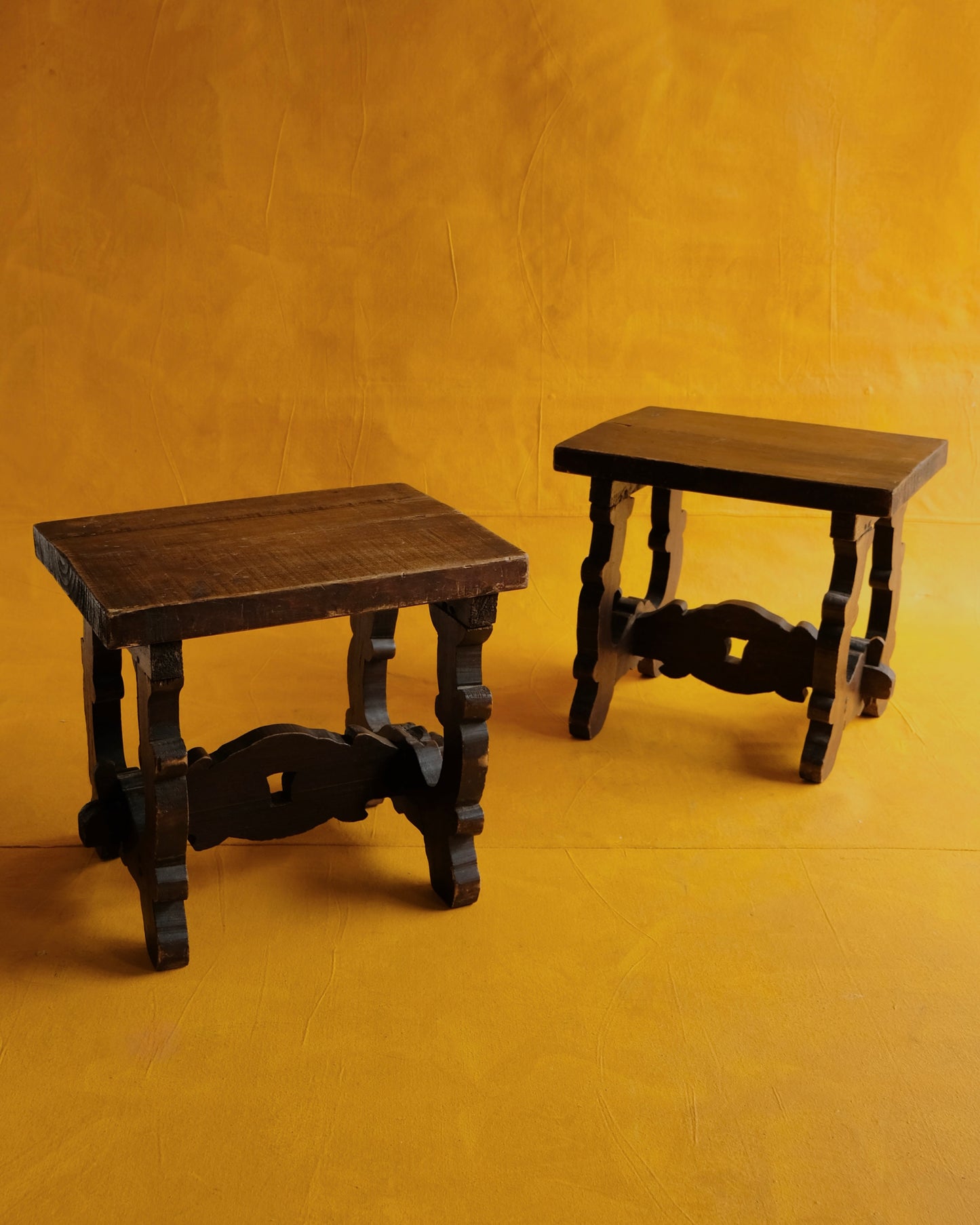 PAIR OF INTERLOCKING SPANISH WALNUT SIDE TABLES