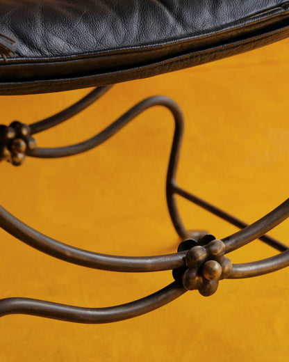 PAIR OF IRON CURULE CHAIRS w. FLORAL DETAIL