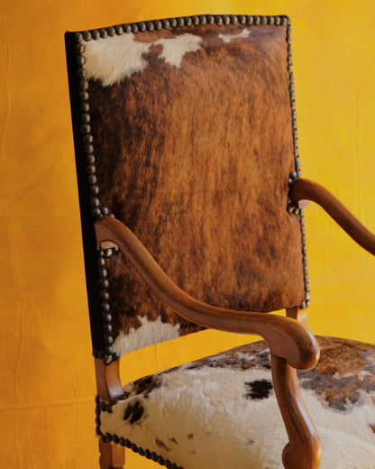 PAIR OF SPANISH WALNUT & COW HIDE ARMCHAIRS