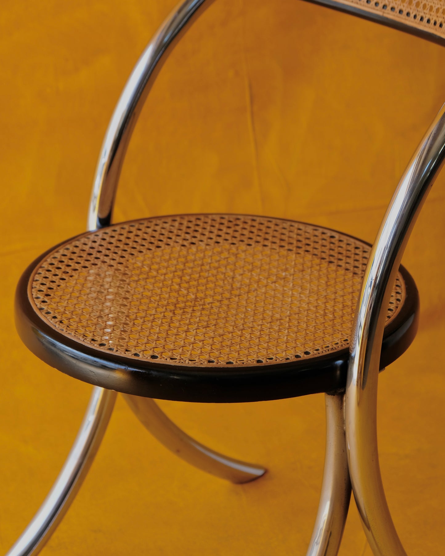 SET OF EIGHT CURVED CHROME & RATTAN CHAIRS