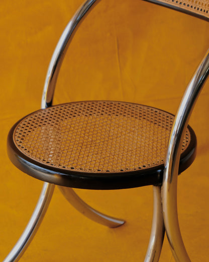SET OF EIGHT CURVED CHROME & RATTAN CHAIRS
