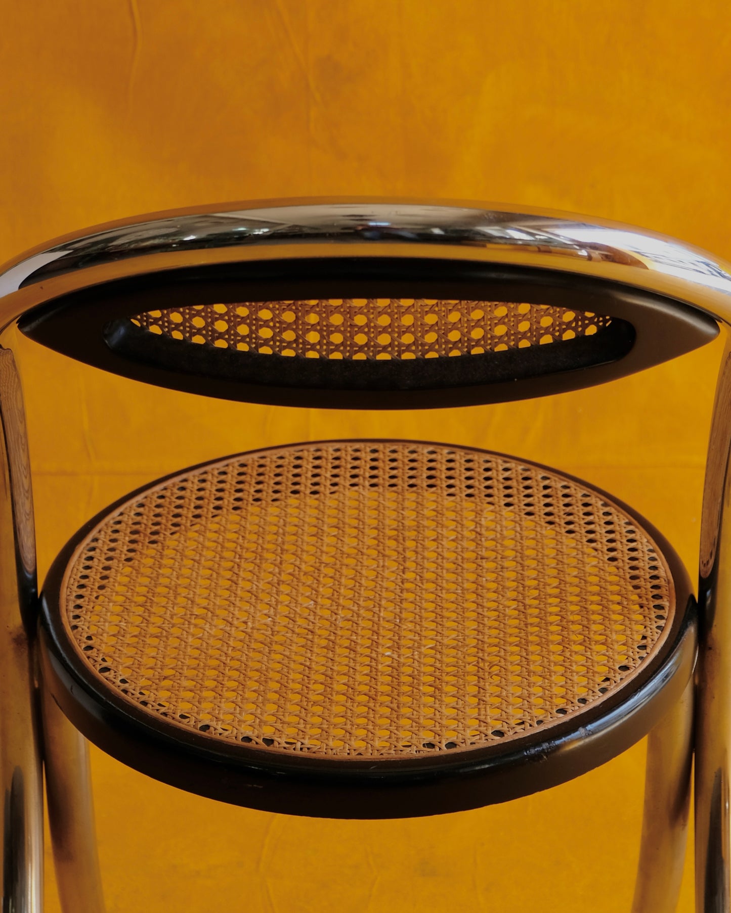 SET OF EIGHT CURVED CHROME & RATTAN CHAIRS