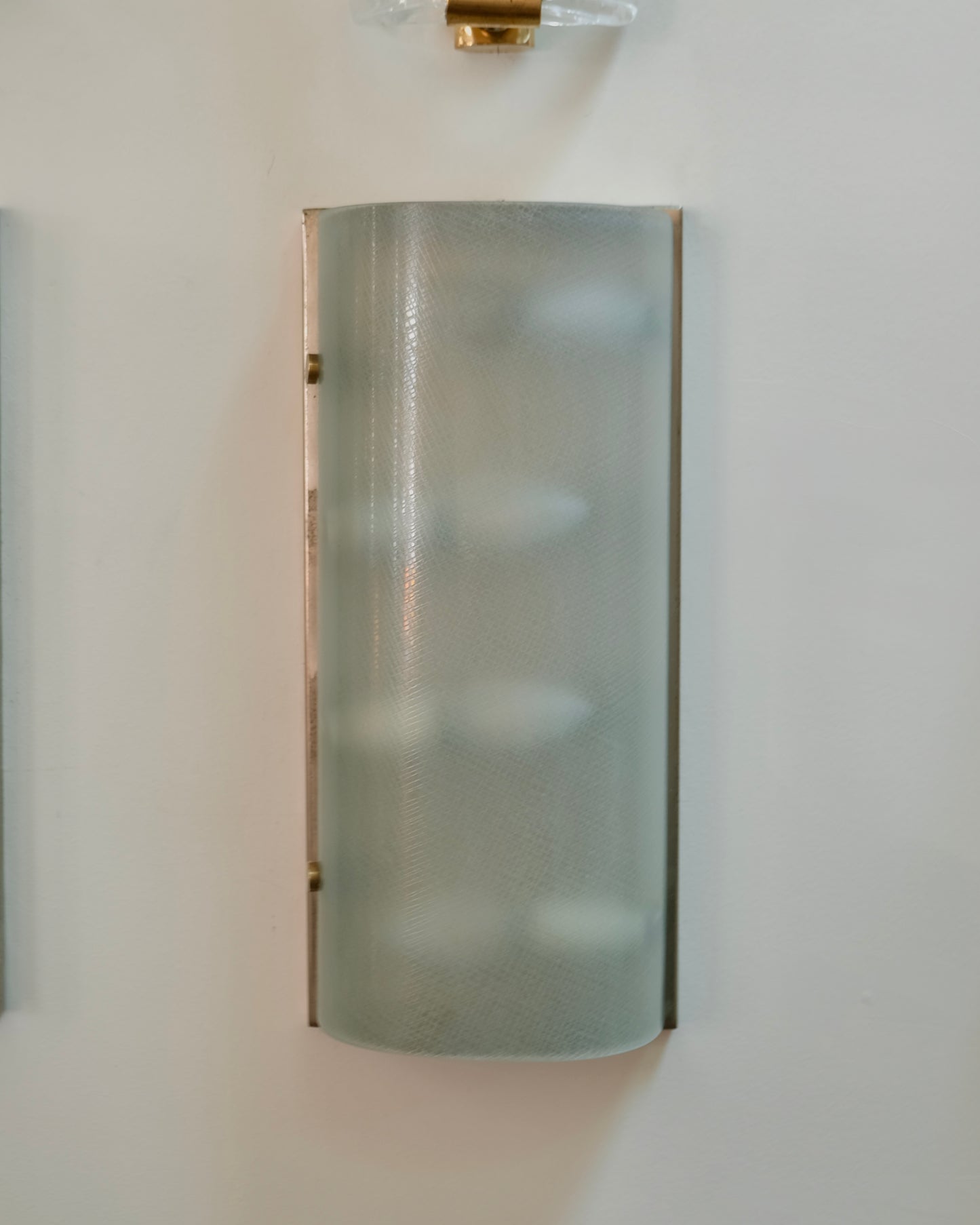 FOUR LIGHT TEXTURED FONTANA ARTE BRASS CLIP SCONCES