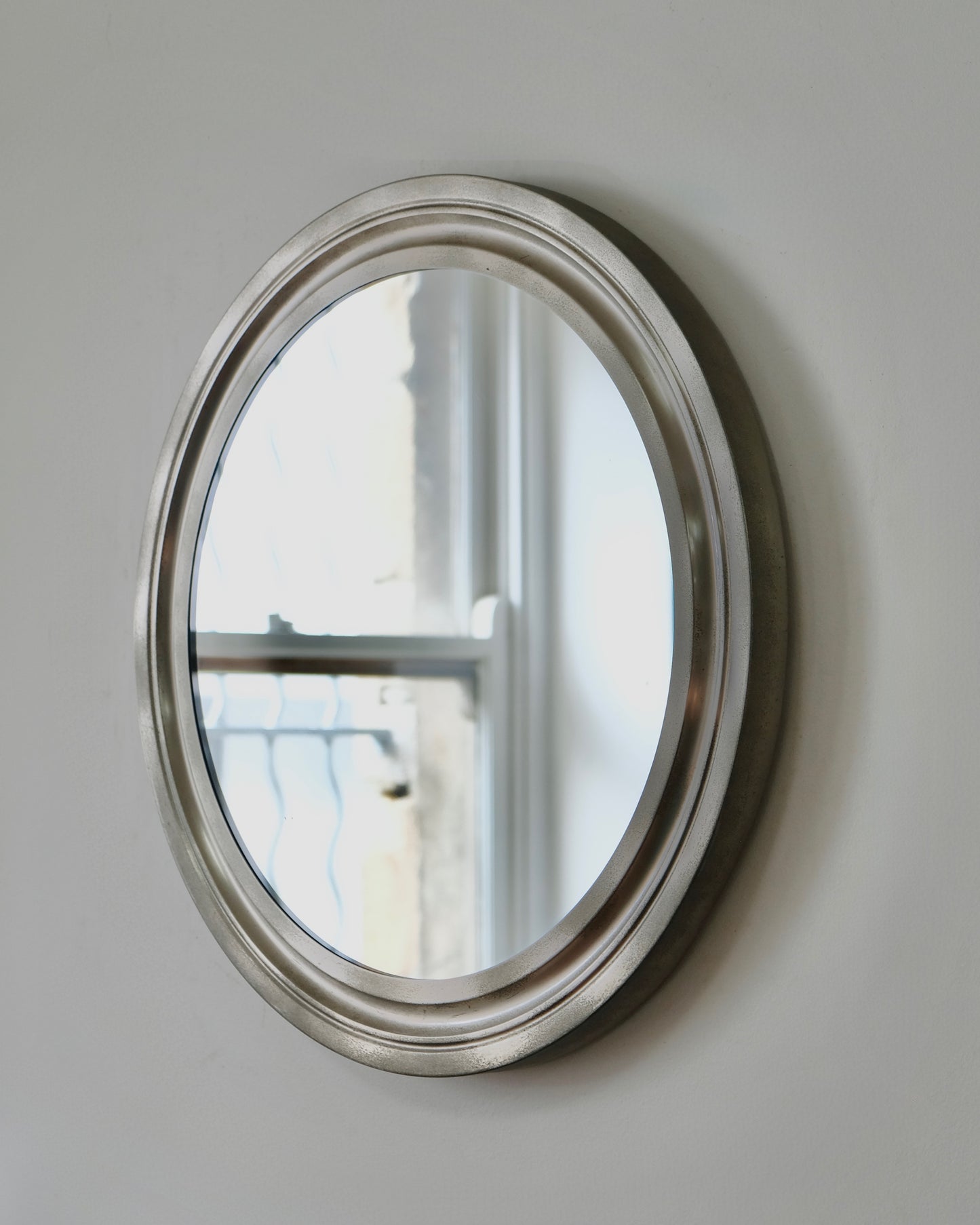 MID-CENTURY ITALIAN ROUND ALUMINIUM MIRROR