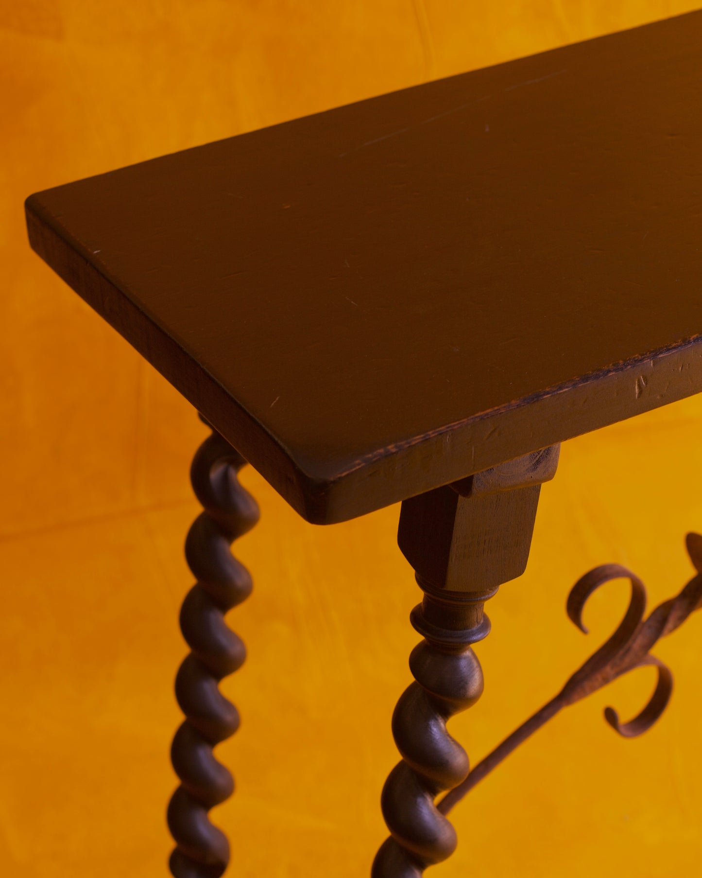 BAROQUE SPANISH EBONIZED CONSOLES w. FORGED IRON TRESTLE LEG