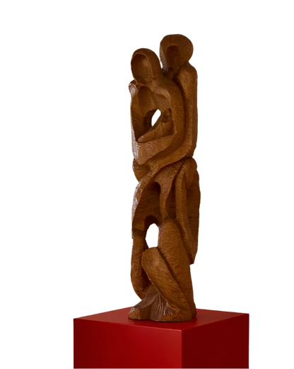 HAND CARVED EMBRACE SCULPTURE