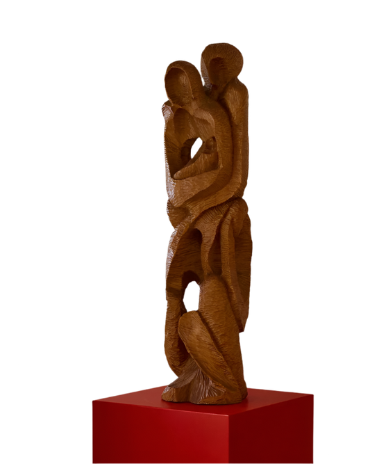 HAND CARVED EMBRACE SCULPTURE