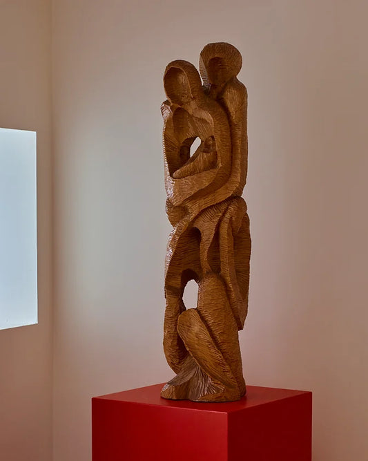 HAND CARVED EMBRACE SCULPTURE