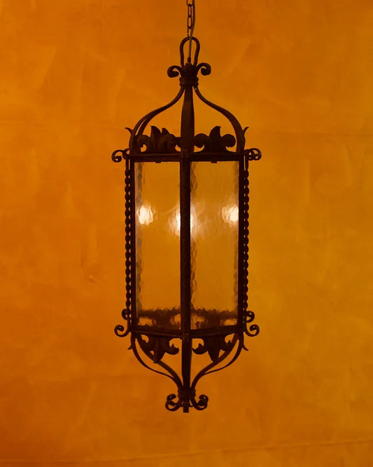 PAIR OF WROUGHT IRON SCALLOP LANTERNS