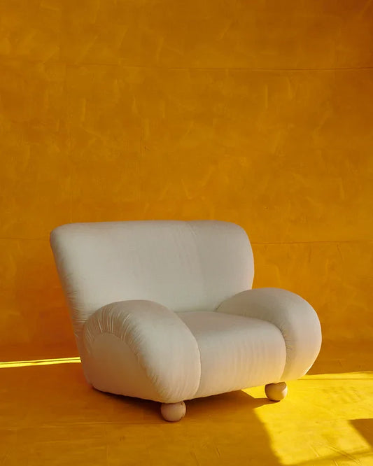 PAIR OF UPHOLSTERED CURVED ARMCHAIRS