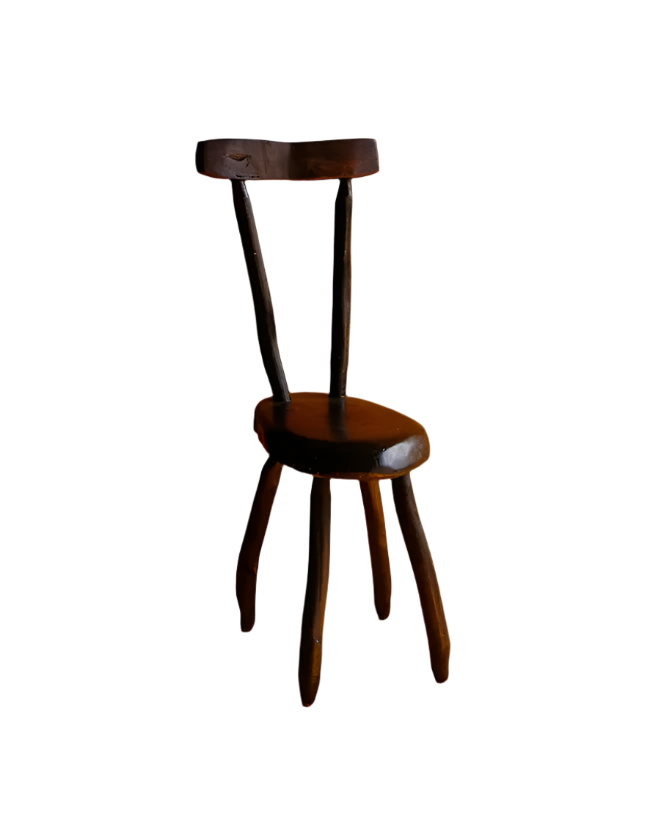HAND CARVED EBONIZED PRIMITIVE CHAIR