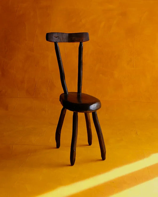 HAND CARVED EBONIZED PRIMITIVE CHAIR