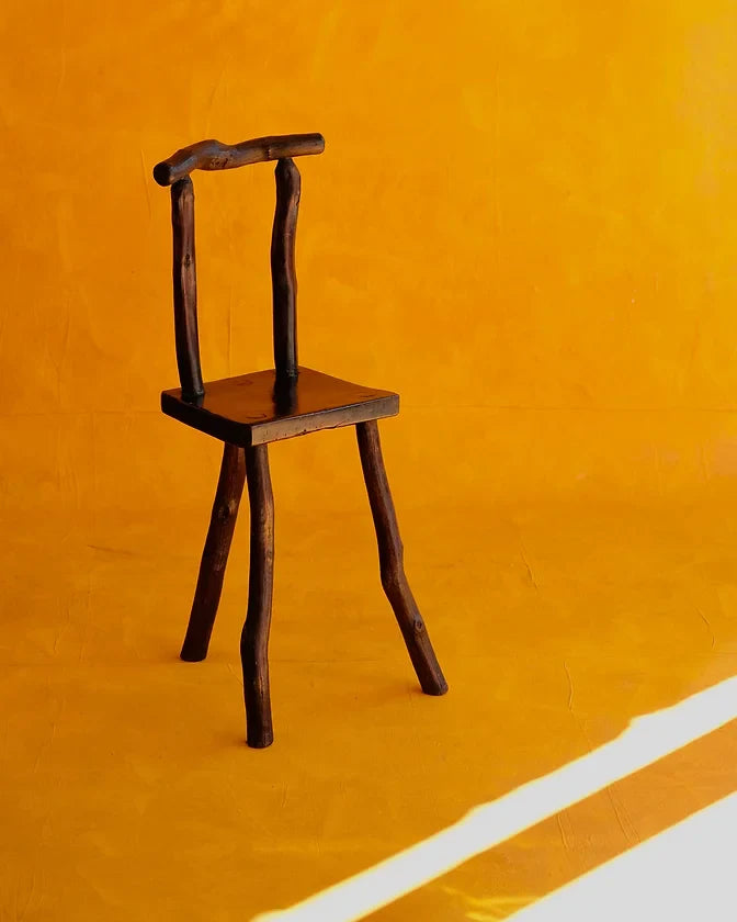 HAND CARVED EBONIZED PRIMITIVE TALL CHAIR
