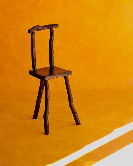 HAND CARVED EBONIZED PRIMITIVE TALL CHAIR